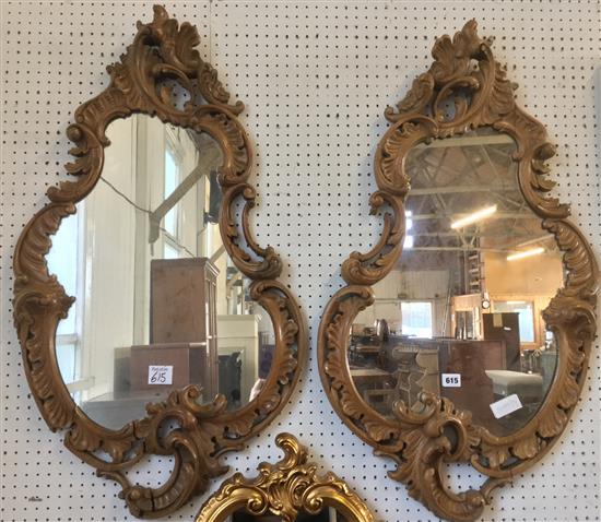 Pair of shaped carved mirrors